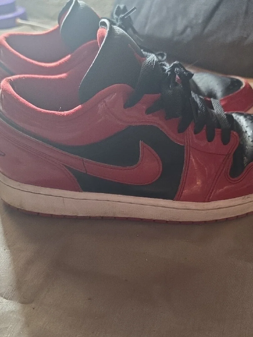 Jordan Red and Black High-Top Sneaker Tongue Label Detail